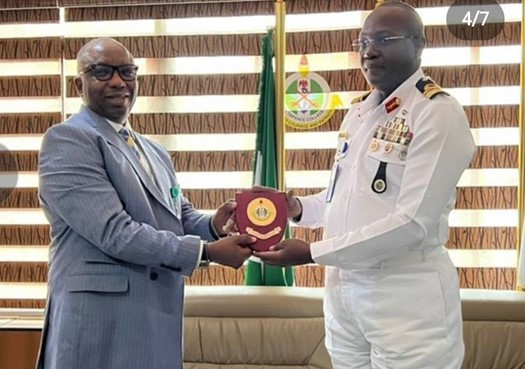 The NC/CEO NDPB receives an award from the Commandant of National Defence College, Rear Admiral Murtala Momoni Bashir, in Abuja.